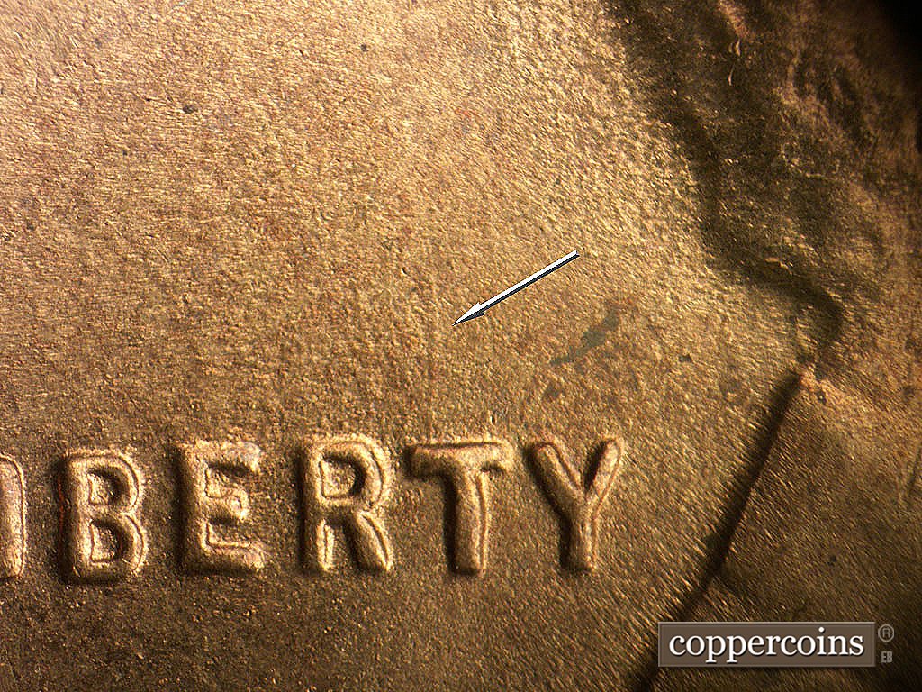 Die-stage C marker on 1945S•1MM•032 showing N/S die gouge from T in LIBERTY.