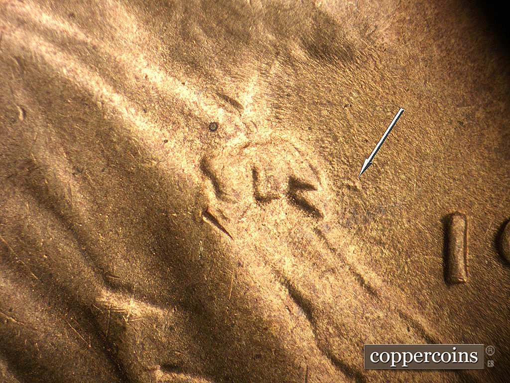 Die-stage C marker on 1945S•1MM•032 showing Die gouge in front of bowtie.