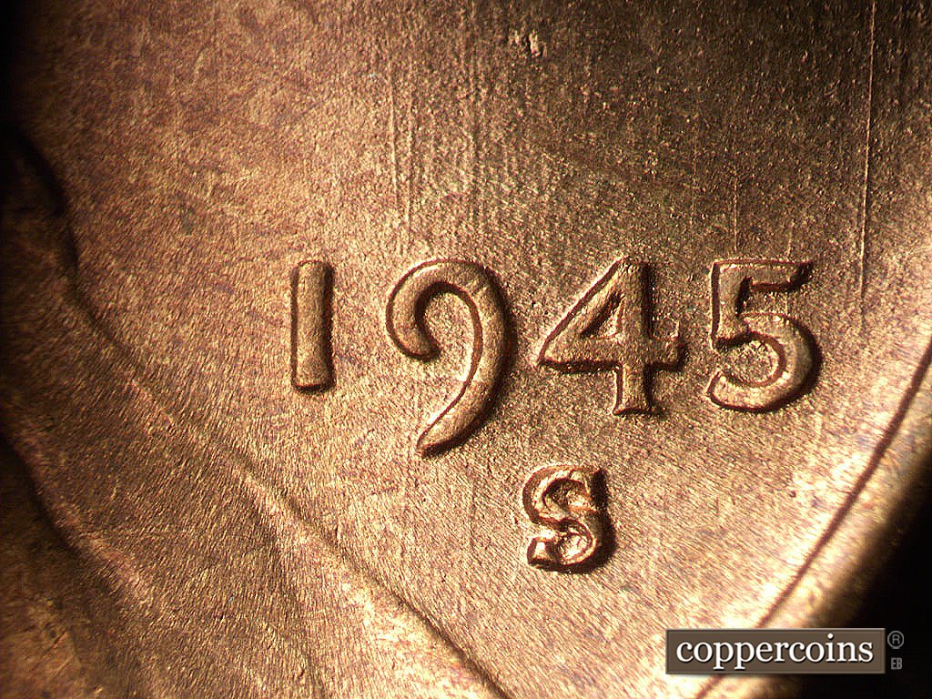 Die-stage B marker on 1945S•1MM•033 showing N/S die scratch through date.