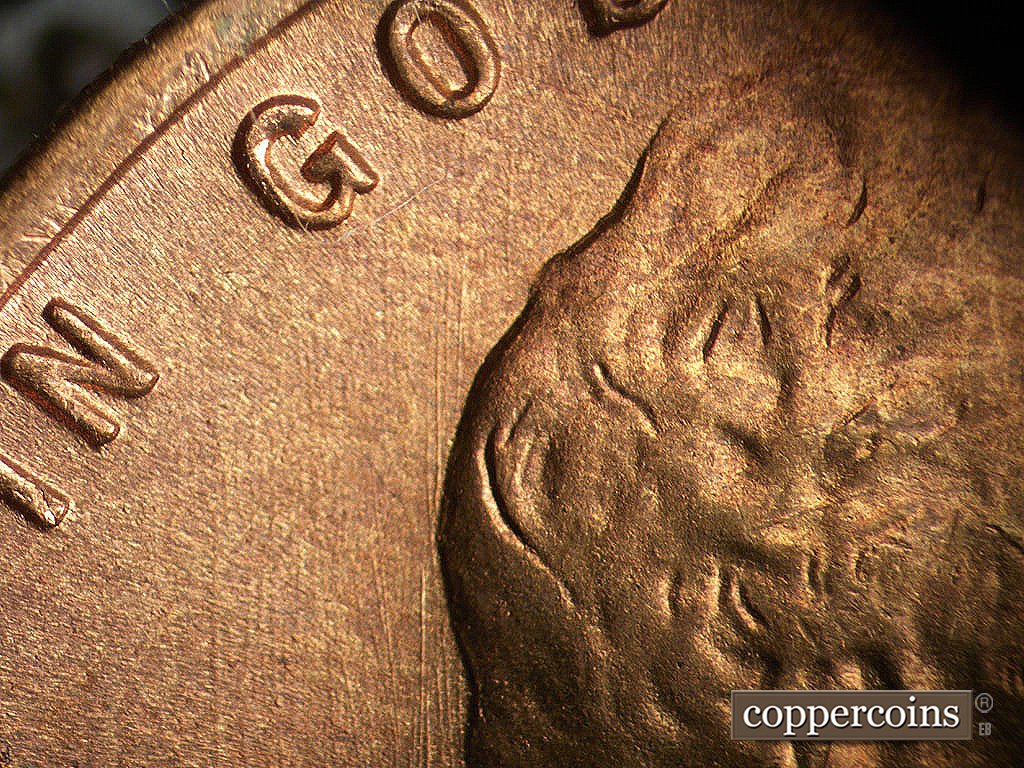 Die-stage B marker on 1945S•1MM•033 showing N/S die scratches under GOD.