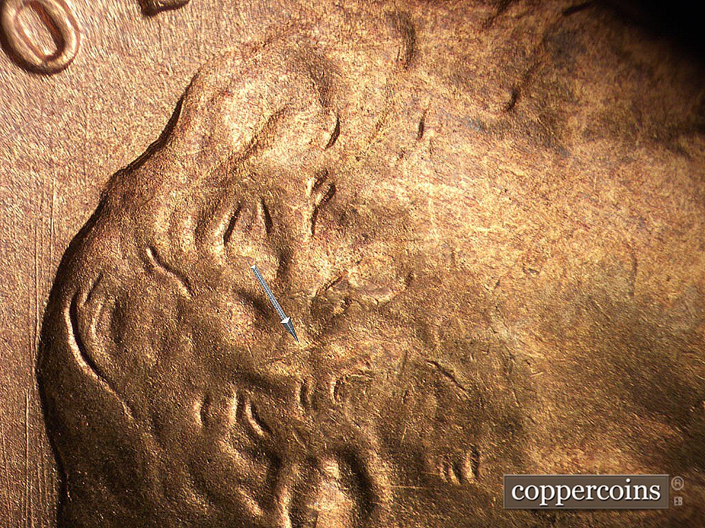 Die-stage B marker on 1945S•1MM•033 showing Die crack in hair.