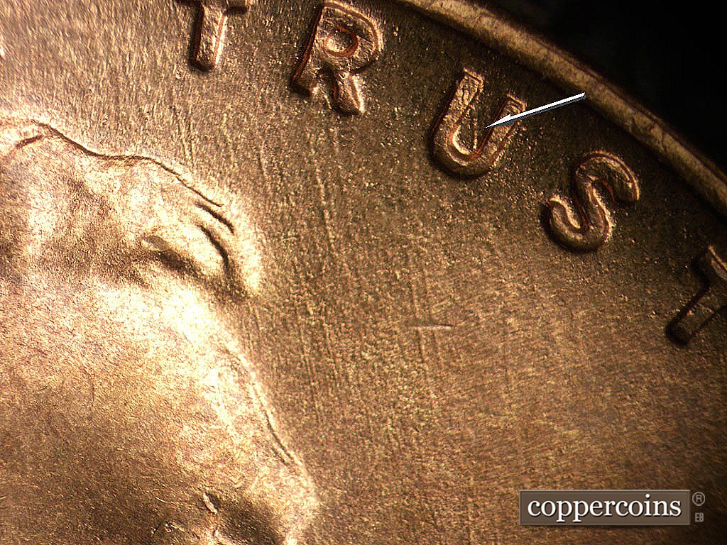 Die-stage B marker on 1945S•1MM•033 showing SSE die scratches under TRUST.