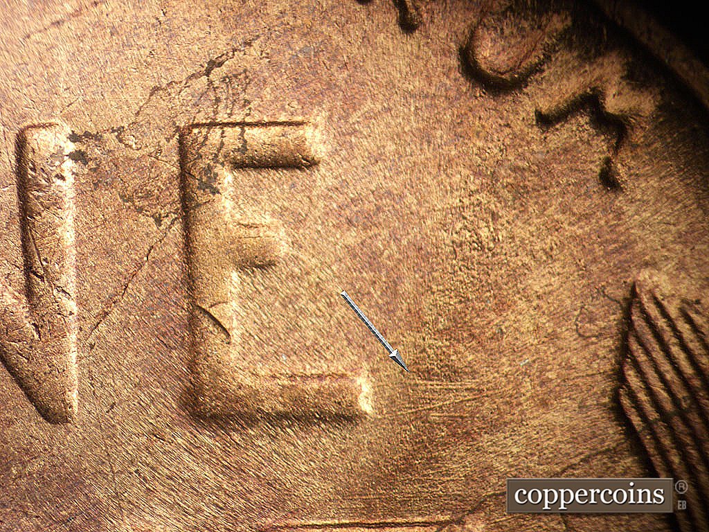 Die-stage B marker on 1945S•1MM•033 showing E/W die scratches right of E in ONE.