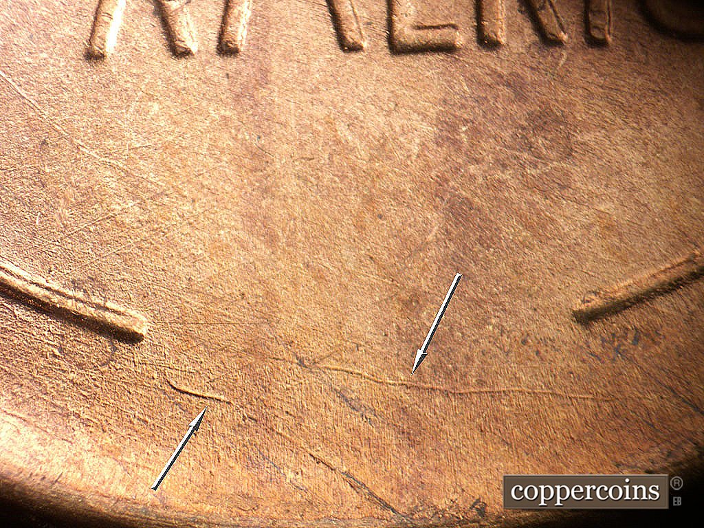 Die-stage A marker on 1946D•1DO•009 showing Unigue die scratches between wheat stems.