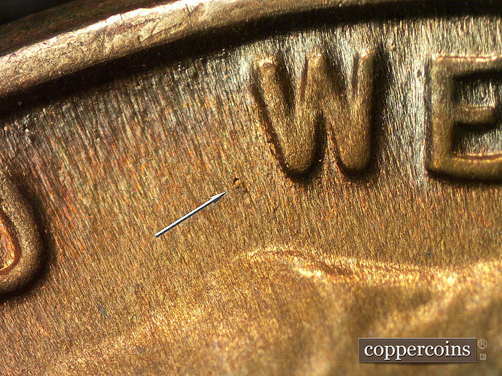 Die-stage C marker on 1946D•1MM•017 showing Die gouge west of W in WE.