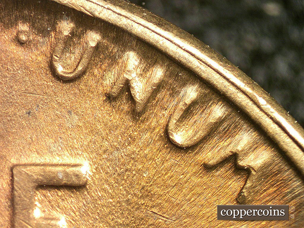 Die-stage C marker on 1946D•1MM•017 showing DIe wear under UNUM.
