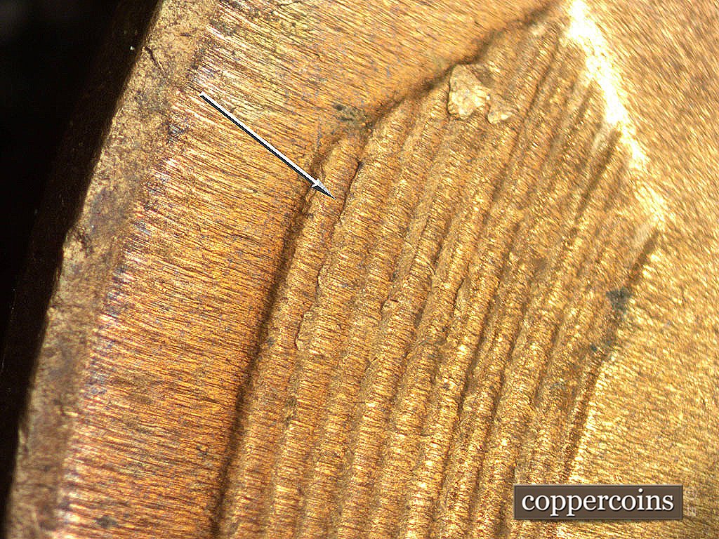 Die-stage C marker on 1946D•1MM•017 showing Die crack on left wheat stalk.