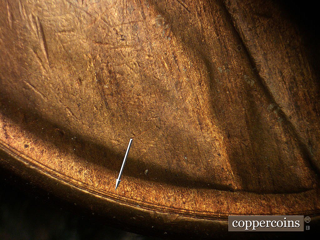 Die-stage B marker on 1946D•1MM•073 showing Concentric die scratch between rim and VDB.