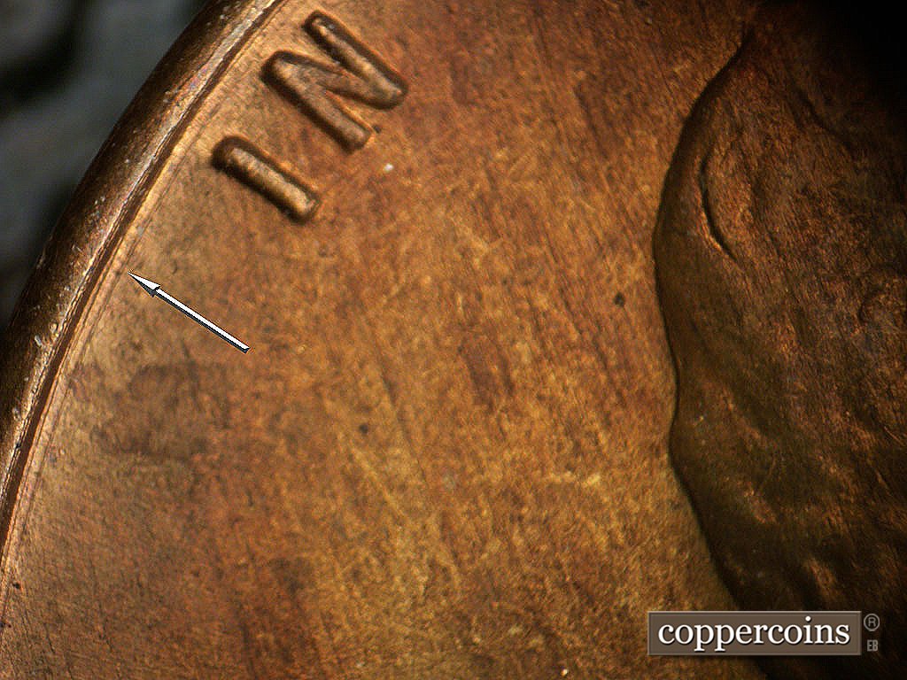 Die-stage B marker on 1946D•1MM•073 showing Concentric die scratch between rim and IN.
