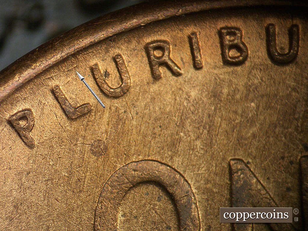 Die-stage B marker on 1946D•1MM•073 showing Die scratches between rim and PLURIBUS.