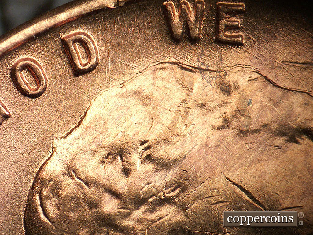 Die-stage A marker on 1946D•1MM•076 showing NW die scratches from top of hair.