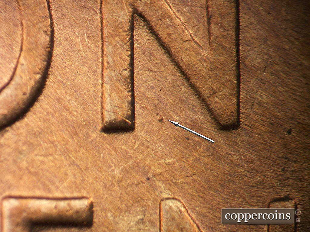 Die-stage B marker on 1946D•1MM•077 showing Die dot in N of ONE.