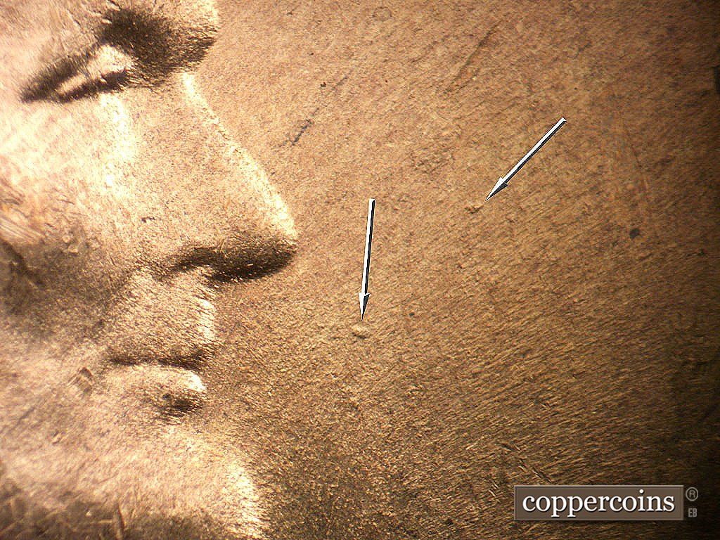 Die-stage B marker on 1946D•1MM•078 showing Die dots in front of face.
