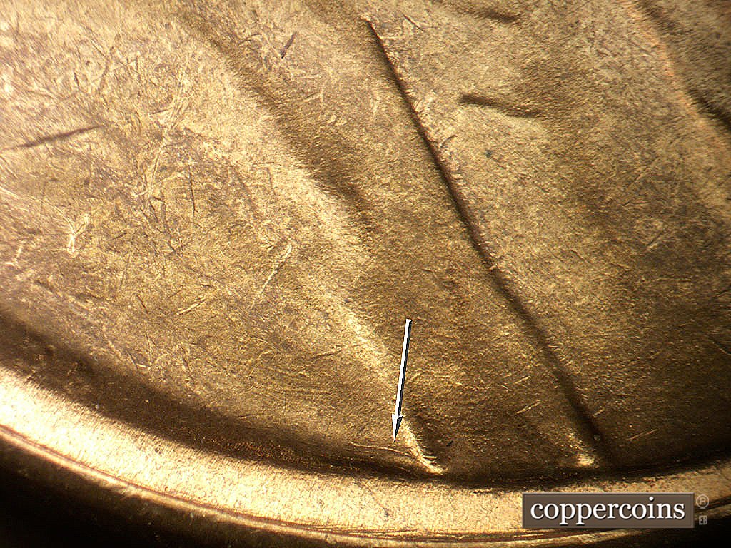 Die-stage B marker on 1946D•1MM•079 showing Unique die scratch on bottom of shoulder right of VDB.