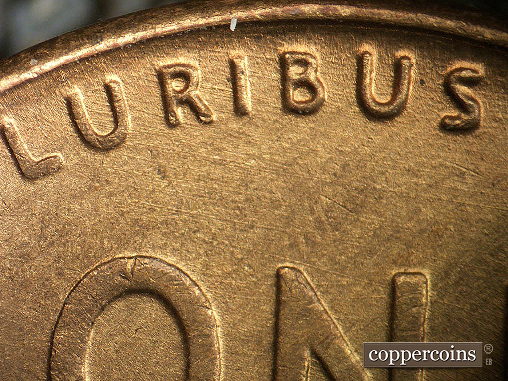 Die-stage B marker on 1946D•1MM•079 showing ESE die scratches through PLURIBUS.