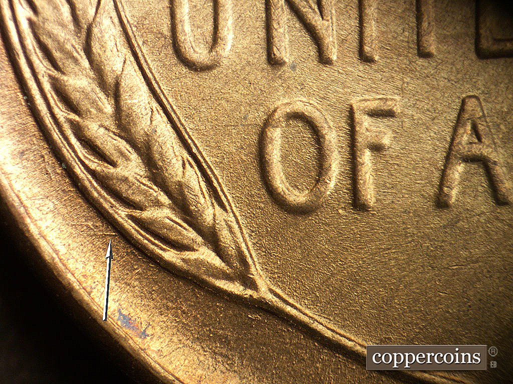 Die-stage B marker on 1946D•1MM•079 showing Short E/W die scratches between rim and left wheat stalk.