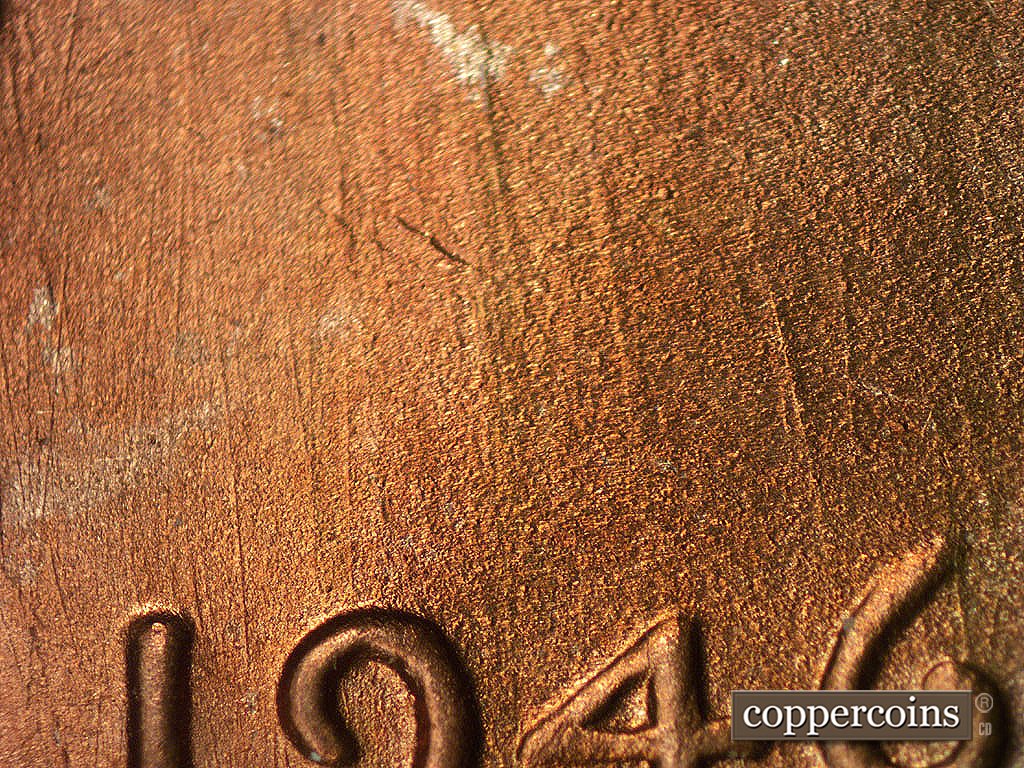 Die-stage B marker on 1946S•1MM•075 showing NNW die scratches above date.