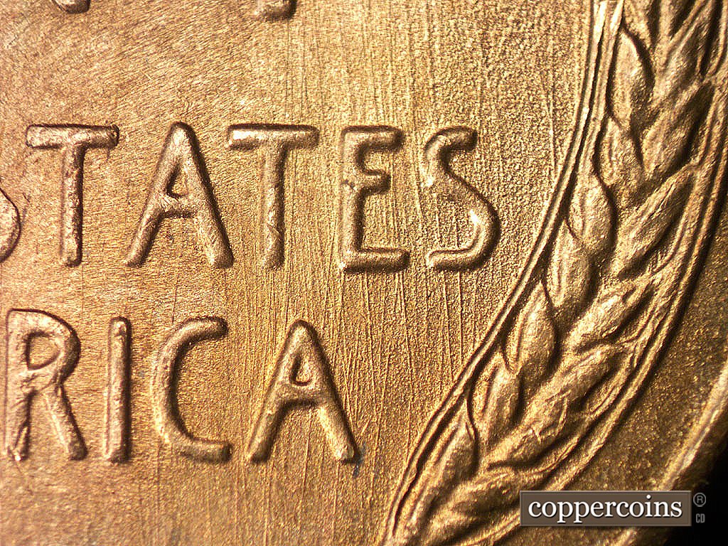 Die-stage B marker on 1946S•1MM•075 showing N/S die scratches through TES in STATES and CA in AMERICA.