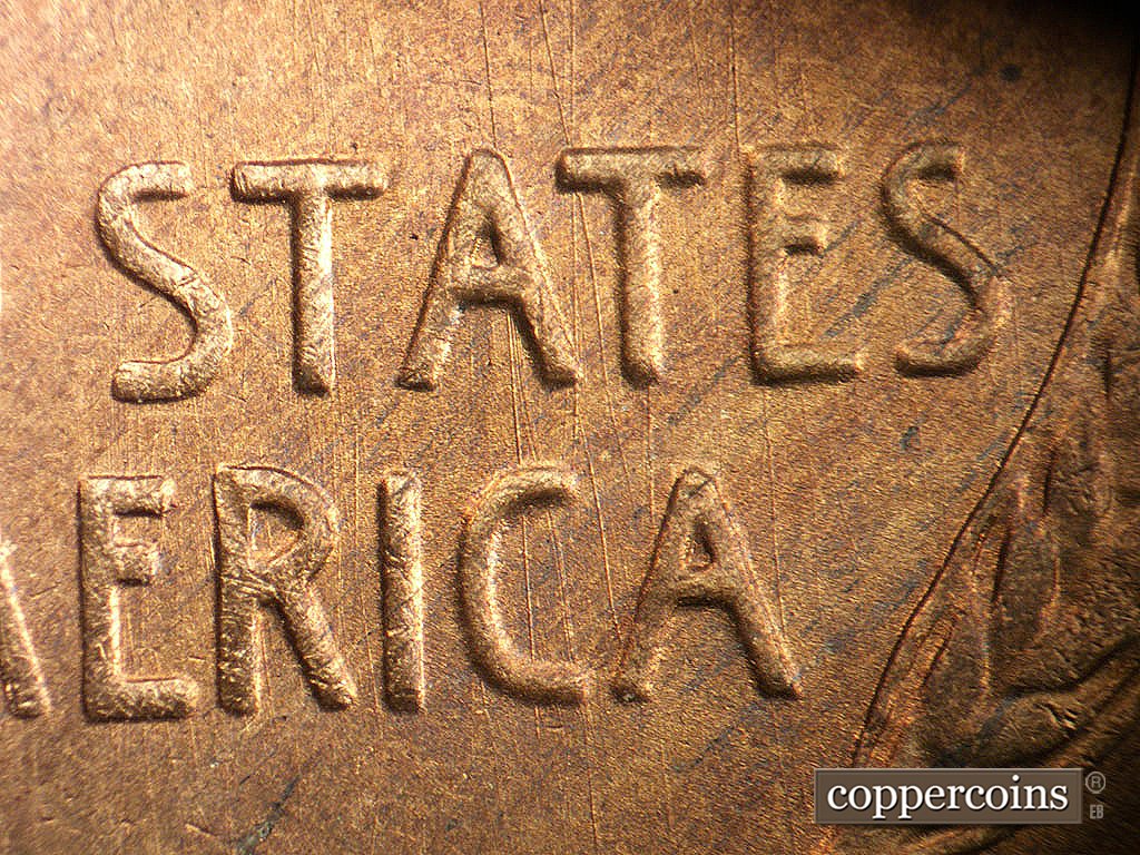 Die-stage A marker on 1946S•1MM•076 showing Generally N/S die scratches through STATES and AMERICA.