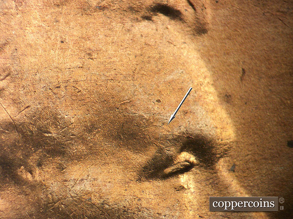 Die-stage B marker on 1947D•1MM•035 showing Die crack on eyebrow.