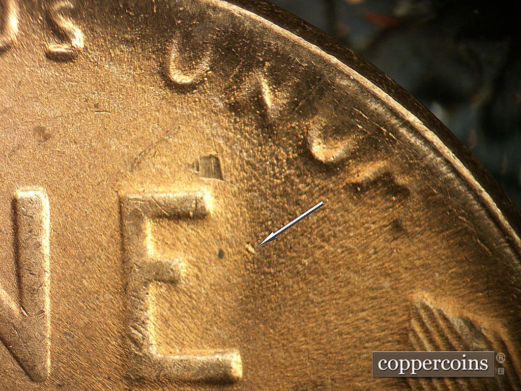 Die-stage C marker on 1948D•1DO•008 showing Die gouge east of E in ONE.