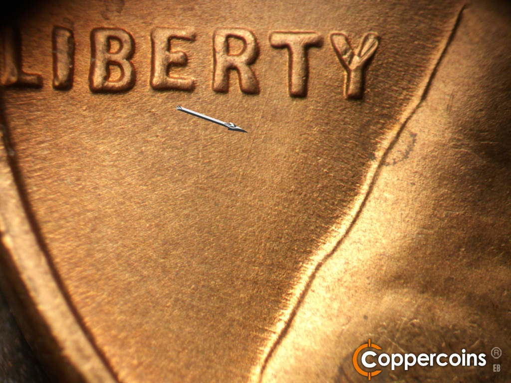 Die-stage B marker on 1948D•1MM•010 showing SSW die scratch from T in LIBERTY.