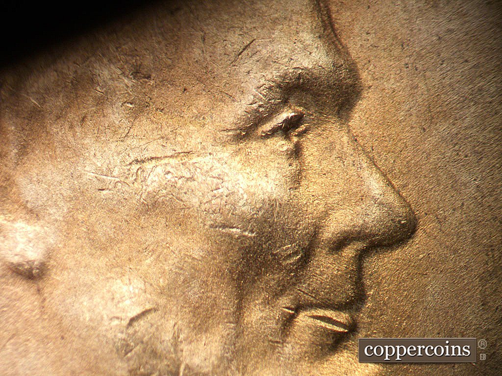 Die-stage B marker on 1948D•1MM•012 showing Closeup of extra upper eyelid south of primary.