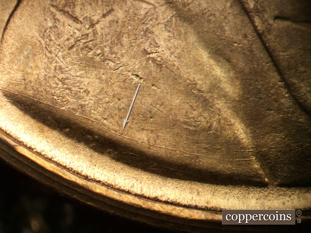 Die-stage B marker on 1948S•1MM•007 showing Die crack over VDB across lower shoulder.
