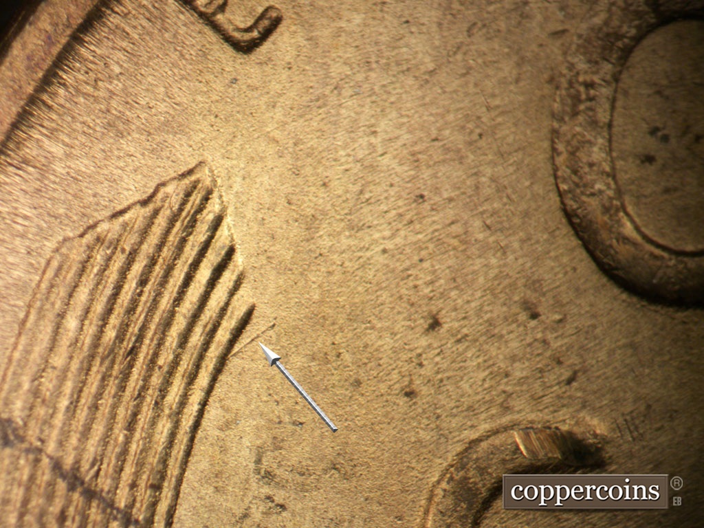 Die-stage B marker on 1948S•1MM•007 showing NE die scratch from top of left wheat stalk.