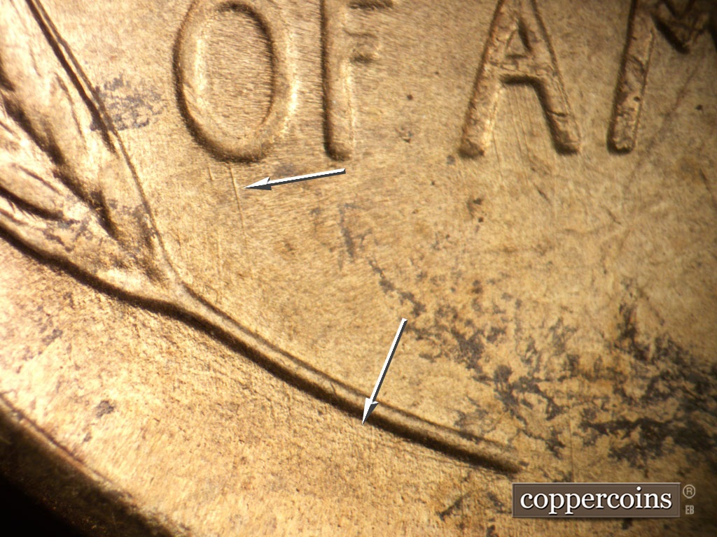 Die-stage B marker on 1948S•1MM•011 showing Die scratch is parallel to the left wheat stem. SSE die scratch comes from bottom of O in OF.