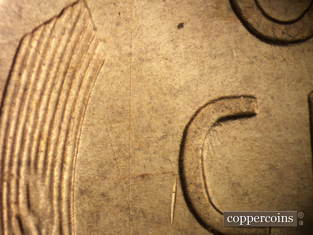 Die-stage B marker on 1948S•1MM•011 showing Die scratches form an X west of the C in CENT.