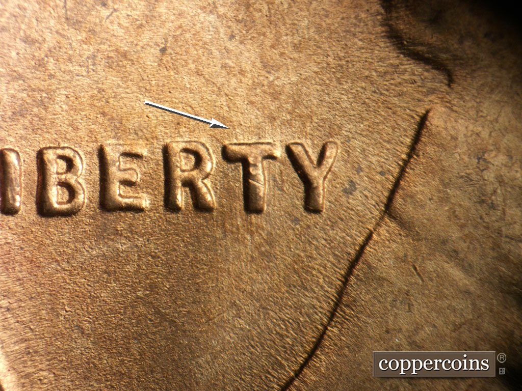 Die-stage B marker on 1948S•1MM•018 showing Worn N/S die scratches visible through T in LIBERTY.