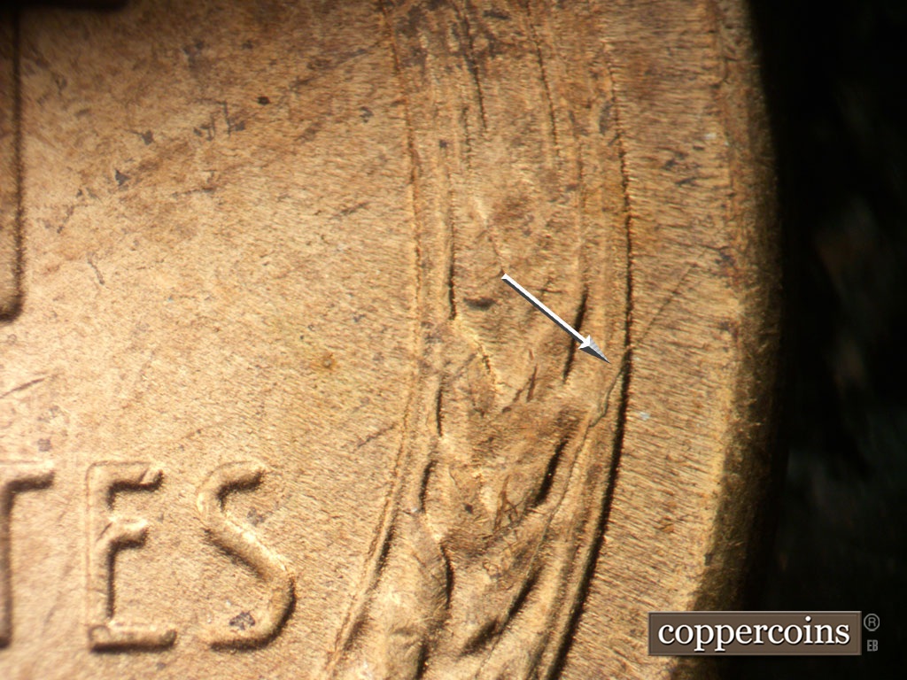 Die-stage B marker on 1948S•1MM•018 showing Die crack through right wheat stalk to rim.