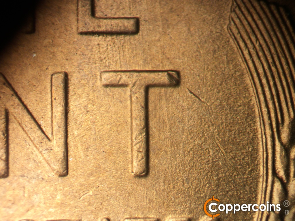 Die-stage B marker on 1948S•1MM•019 showing Worn N/S die scratches from bottom of E in ONE through T in CENT.