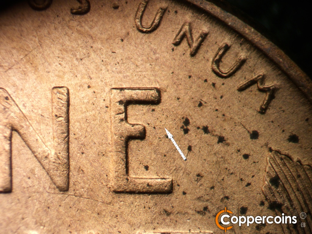 Die-stage B marker on 1949D•1MM•040 showing E/W die scratch from E in ONE.