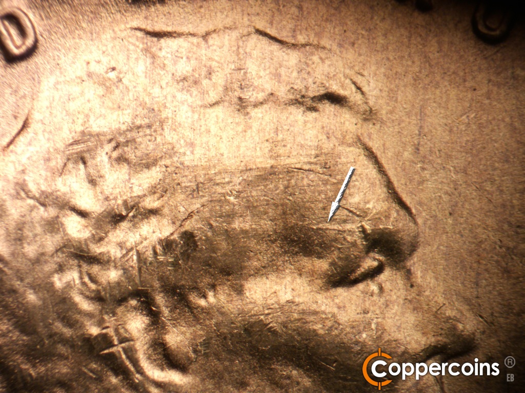 Die-stage C marker on 1949D•1MM•042 showing Die crack above eye.