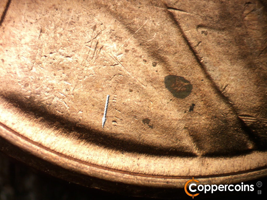 Die-stage B marker on 1949D•1MM•043 showing Light die crack above VDB.