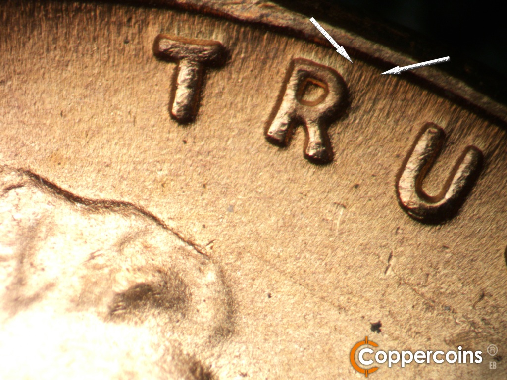 Die-stage B marker on 1949D•1MM•043 showing Unique die flow or gouge from top of R in TRUST.