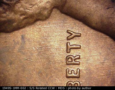 Die-stage B marker on 1949S•1MM•002 (1949 Repunched Mint Mark).