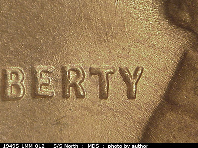 Die-stage B marker on 1949S•1MM•012 (1949 Repunched Mint Mark).