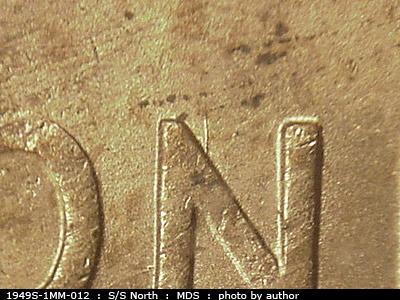 Die-stage B marker on 1949S•1MM•012 (1949 Repunched Mint Mark).