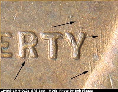 Die-stage B marker on 1949S•1MM•013 (1949 Repunched Mint Mark).