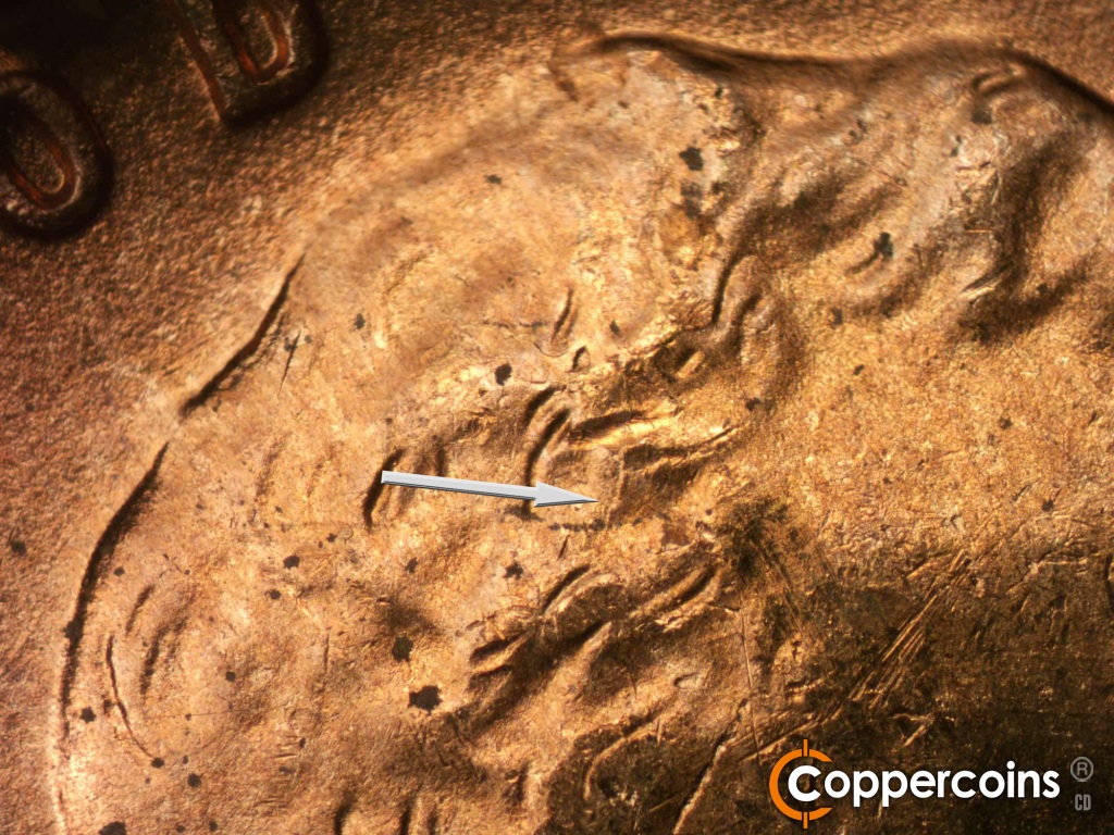 Die-stage B marker on 1950D•1DO•004 showing Die crack in hair.