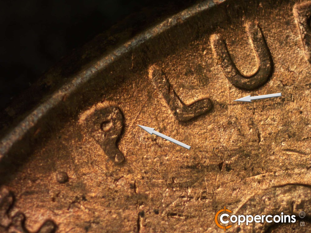 Die-stage B marker on 1950D•1DO•004 showing NE die scratch from P in PLURIBUS. SSE die scratch from bottom of U in PLURIBUS.