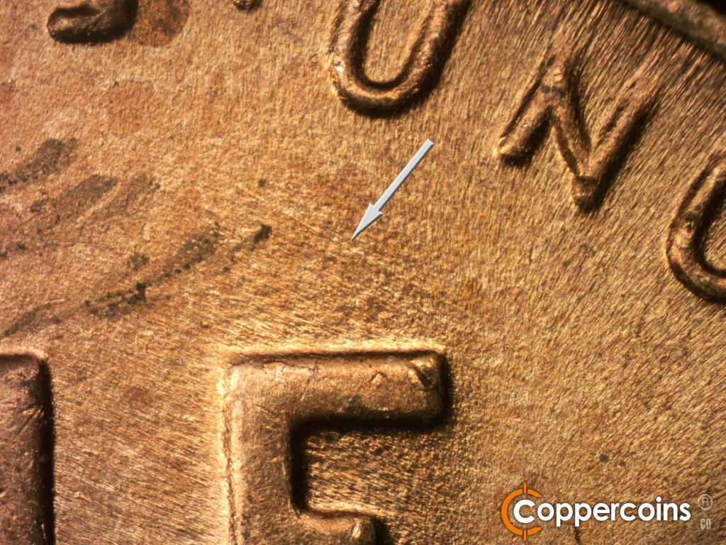 Die-stage B marker on 1950D•1DO•004 showing SE die scratches through and above E in ONE.