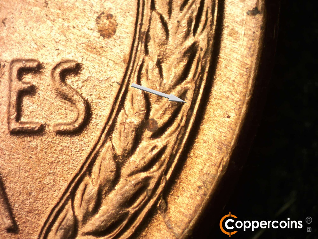 Die-stage B marker on 1950D•1DO•004 showing Die crack in right wheat stalk.
