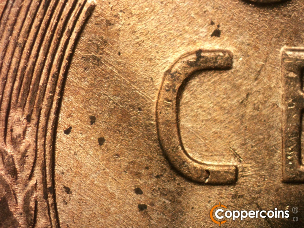 Die-stage B marker on 1950D•1DO•004 showing SE die scratches from left wheat stalk to C in CENT.