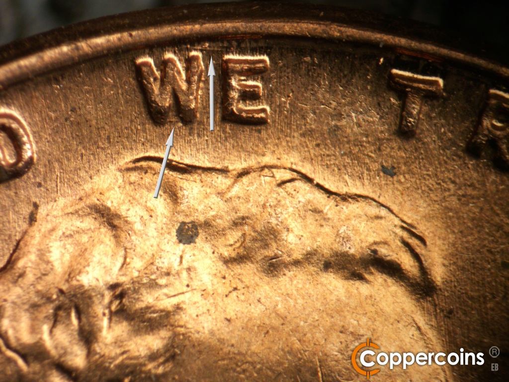 Die-stage B marker on 1950D•1DO•005 showing ESE die scratch from rim to top of E in WE.