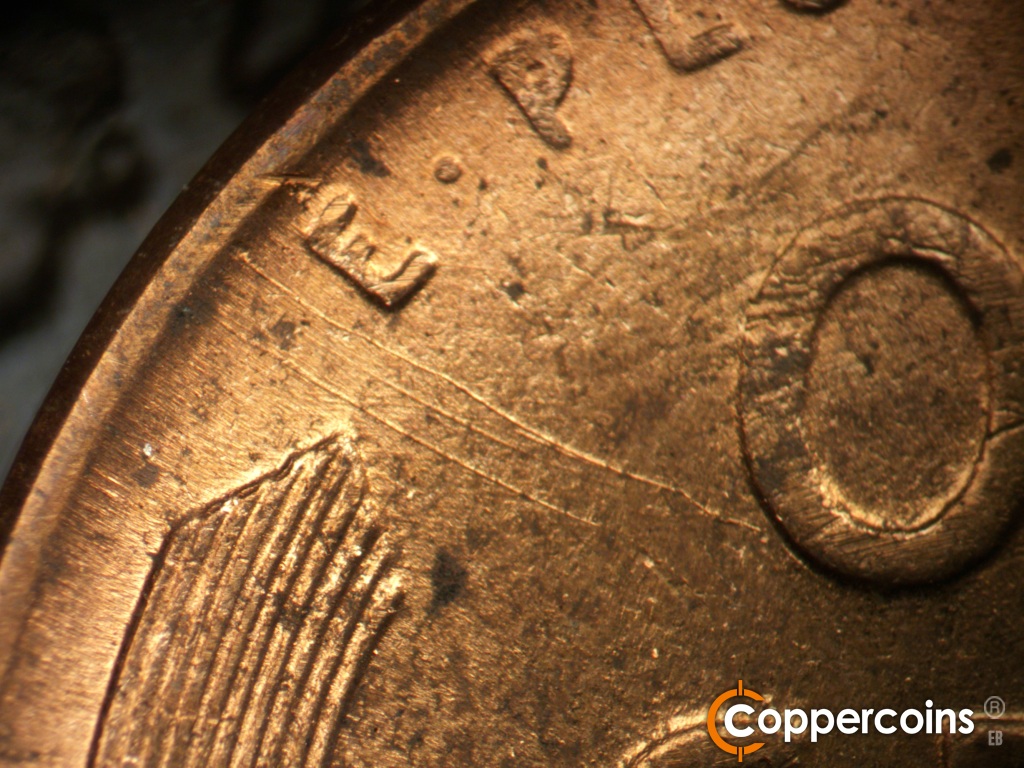 Die-stage B marker on 1950D•1DO•005 showing SE die scratches from rim to O in ONE.