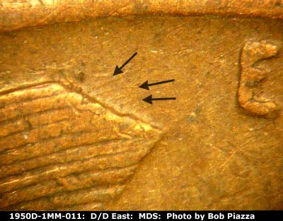 Die-stage B marker on 1950D•1MM•011 showing Die scratches from left wheat stalk tip.